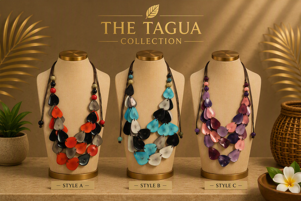 Three statement necklaces displayed on beige jewelry busts against a warm brown backdrop. The necklaces feature layered petal-like elements in different colorways: red, black, and white on the left; blue, black, and white in the center; purple, pink, and gray on the right.
