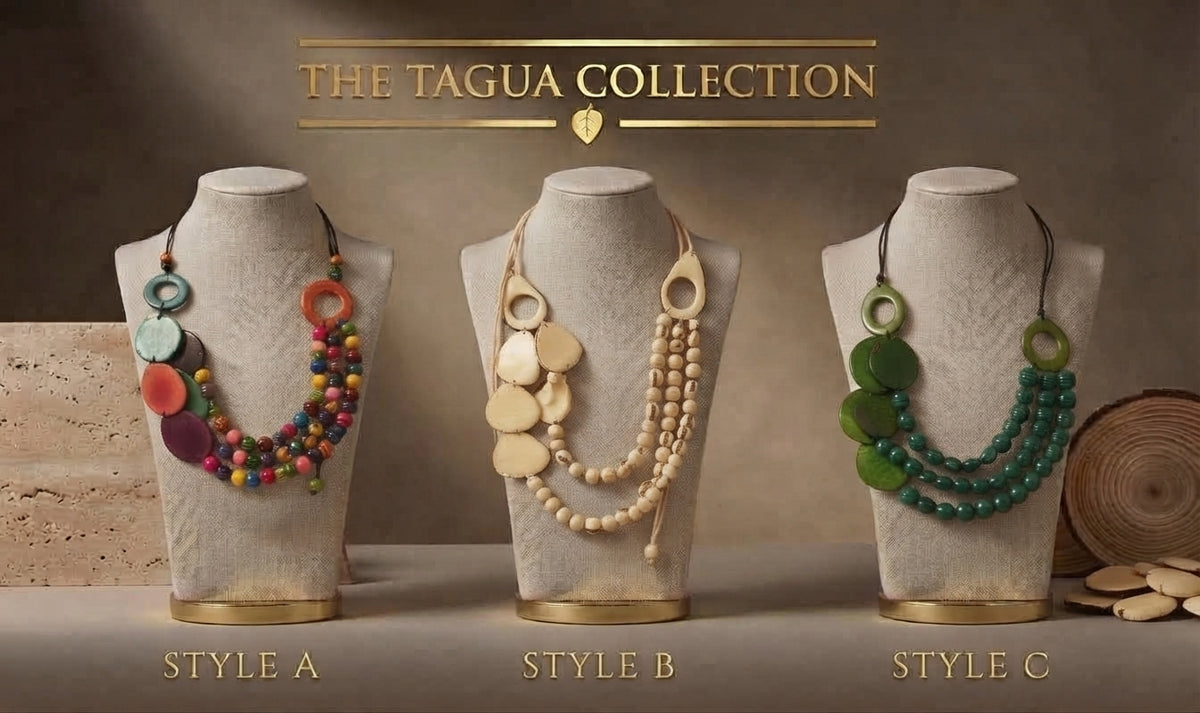Three necklace displays on mannequin busts labeled Style A, Style B, and Style C under the heading 'THE TAGUA COLLECTION.' The necklaces feature mixed colorful beads, cream tagua discs and beads, and green tagua discs, shown against a warm brown studio background with decorative wood props.