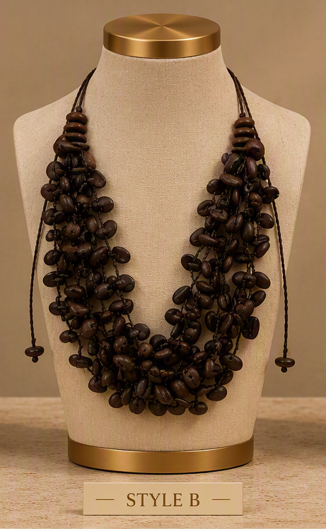 A multi-strand dark brown beaded necklace displayed on a beige fabric jewelry bust with gold-toned metal caps. The necklace features multiple strands of dark brown beads and black cords, shown against a neutral beige background with a label at the bottom reading 'STYLE B'.