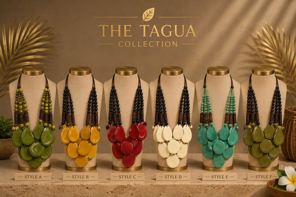 Six Tagua-style necklaces displayed on beige mannequin busts against a warm brown backdrop with decorative palm leaves. The collection shows five different colorways: green, yellow, red, cream, and olive green, with black beaded strands and large disc or bead clusters.